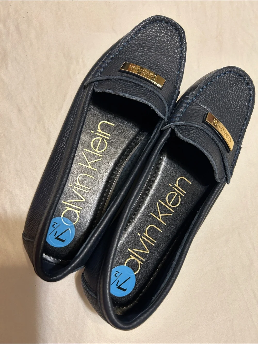 Calvin Klein Women's Navy Leather Moccasin Loafers with Gold Plaque